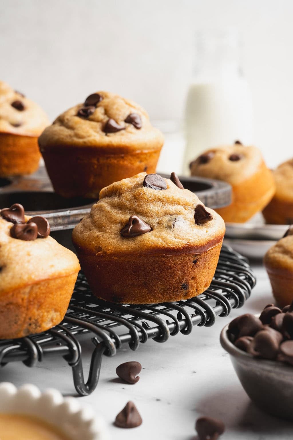 Close up view of Peanut Butter Protein Muffins on a wire cooling rack. 
