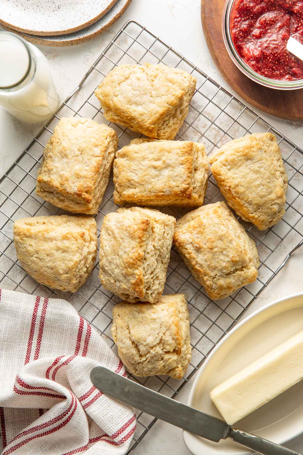 Overhead view of Sweet Cream Biscuits arranged on a wire cooling rack.